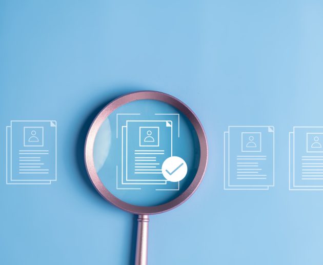 employee background check concept - documents on a blue background with magnifying glass over them