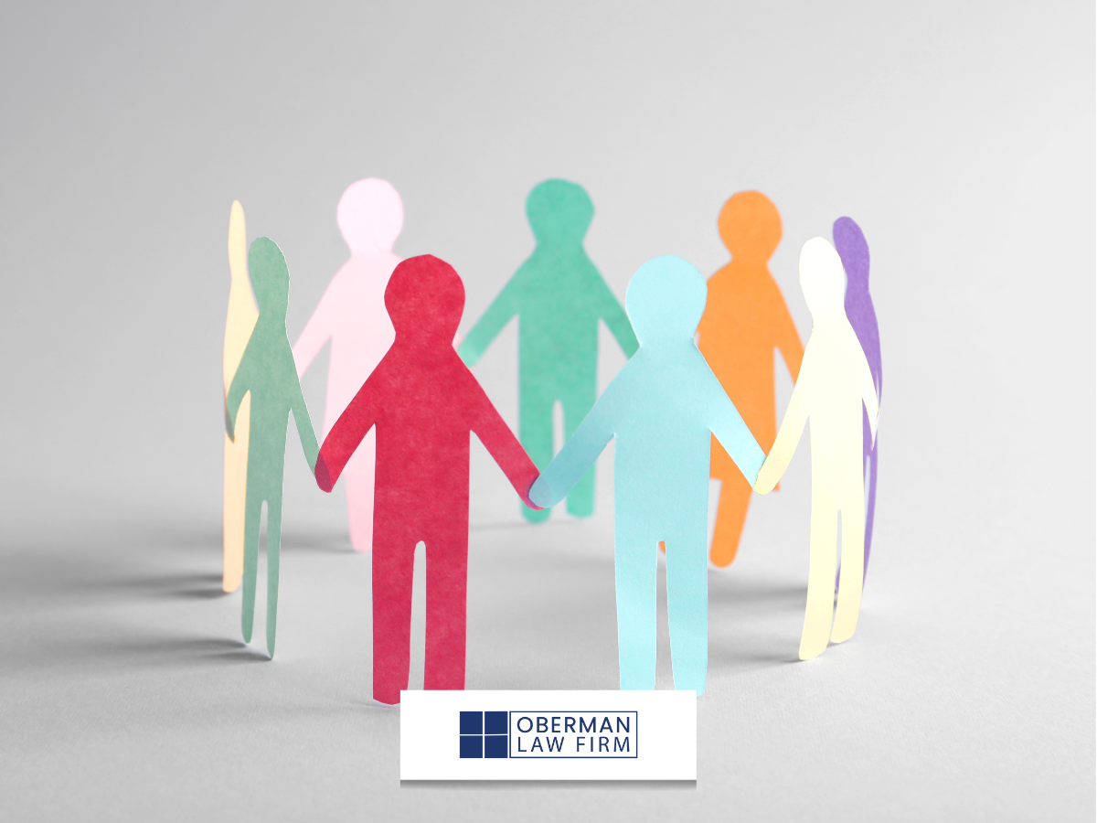 Paper cutouts of people in all different colors in a circle