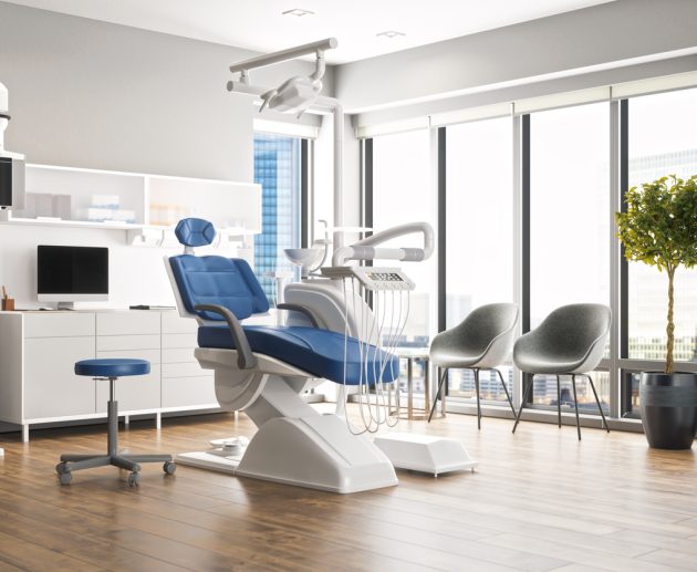 Interior of an empty modern dental clinic room.
