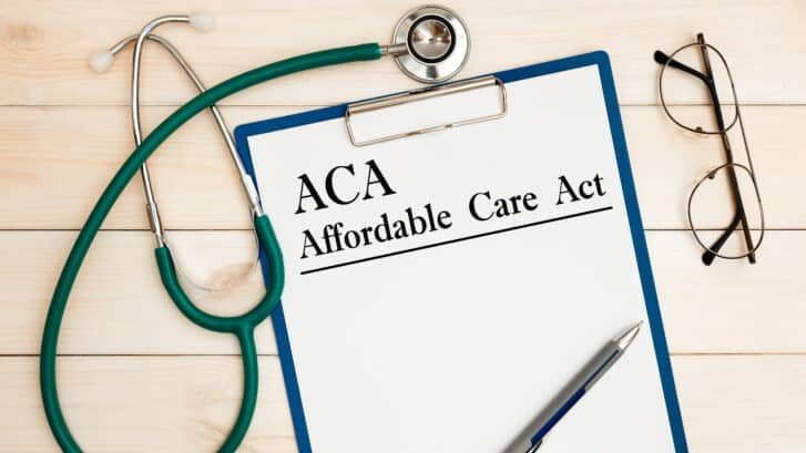 Paper,With,Aca,Affordable,Care,Act,On,The,Office,Table,