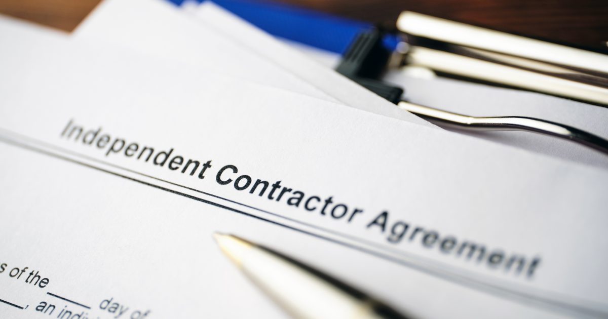 Legal document Independent Contractor Agreement on paper close up