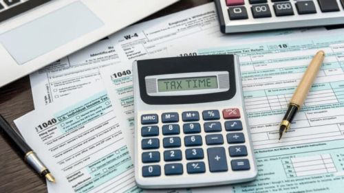 Financial,Time,Tax,Form,With,Laptop,And,Calculator.,Office,Paperwork.