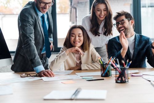 coworkers sitting around table together